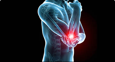 An image of a person holding their elbow where red indicates the pain area